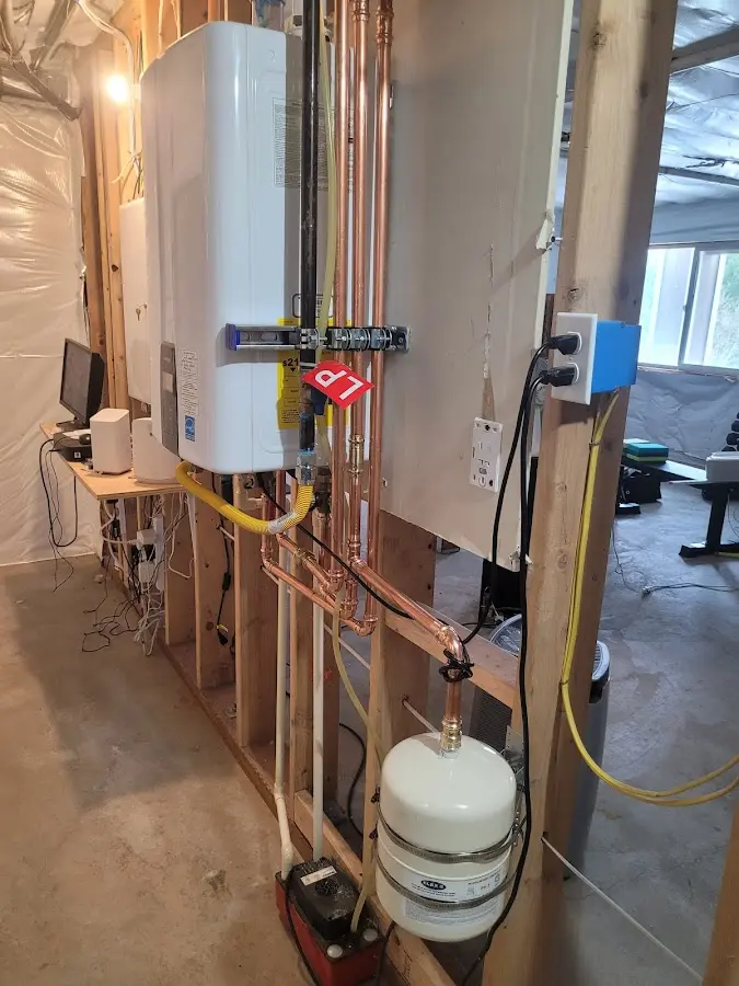 Licensed plumber repairing a kitchen sink in Johnsburg