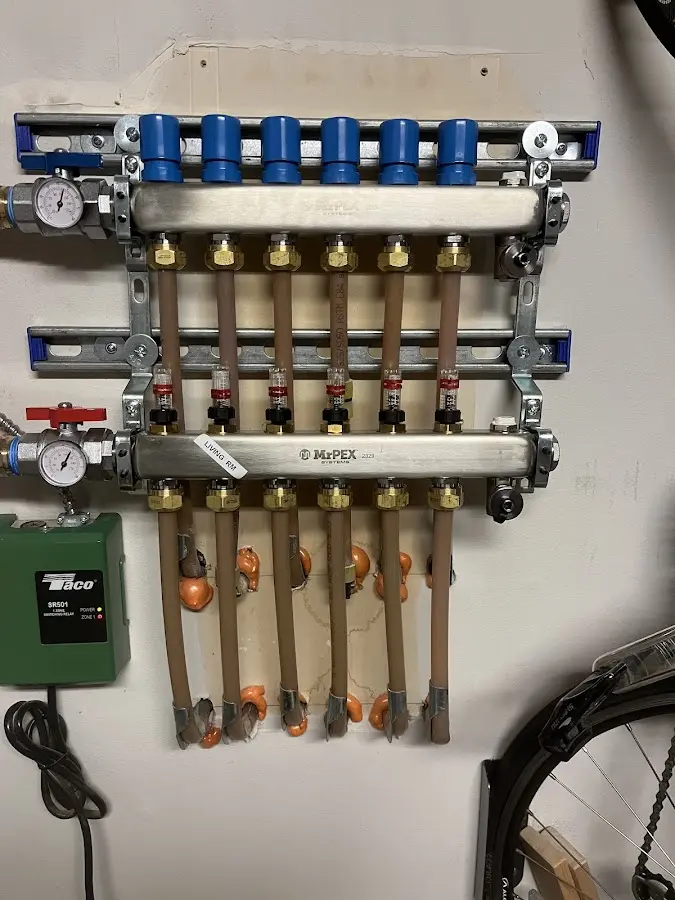 Plumber performing Water Heater Repair at a residential property in Johnsburg